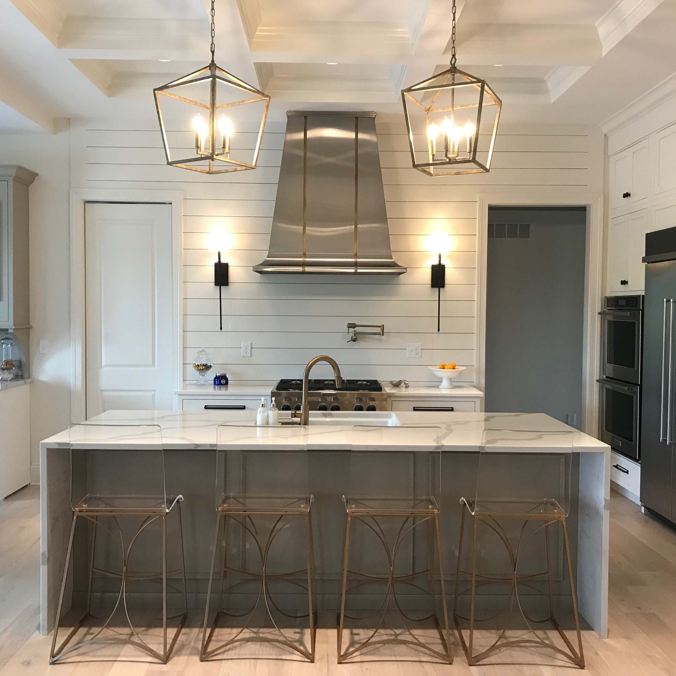 MetalCraft custom metal fabrication stainless bell range hood with light aged brass