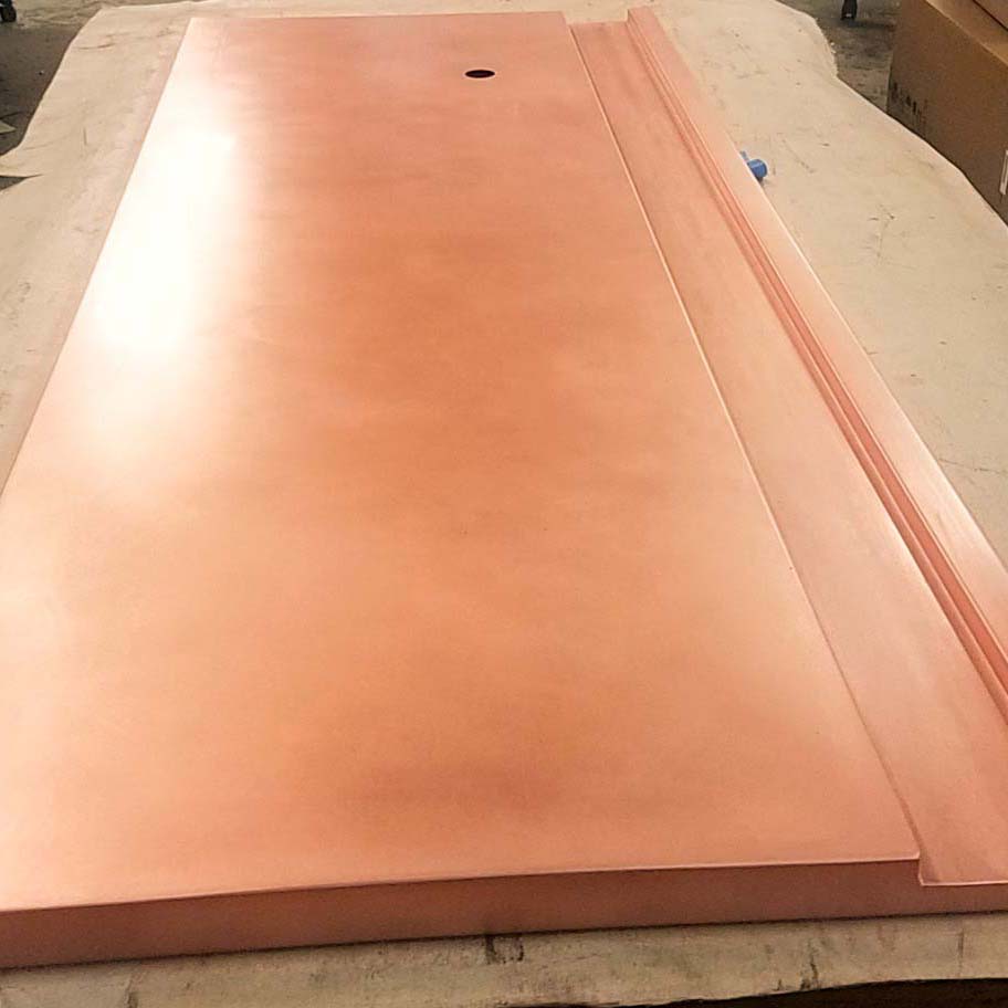 A custom fabricated copper bar top with a drink rail.