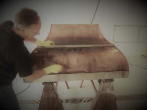 Sometimes a designer likes to get in on the action. Here is Kimball Derrick making sure the finish is just what he envisioned...by doing it himself.