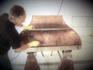 Sometimes a designer likes to get in on the action. Here is Kimball Derrick making sure the finish is just what he envisioned...by doing it himself.