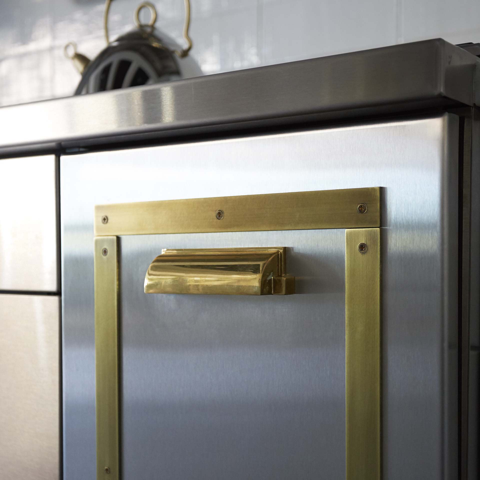 MetalCraft Custom Brass Door Trim Over Stainless Steel for Kitchen Cabinets